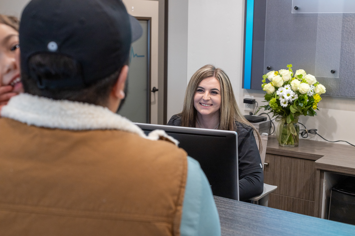 Ridgeline front desk with two receptionists smiling