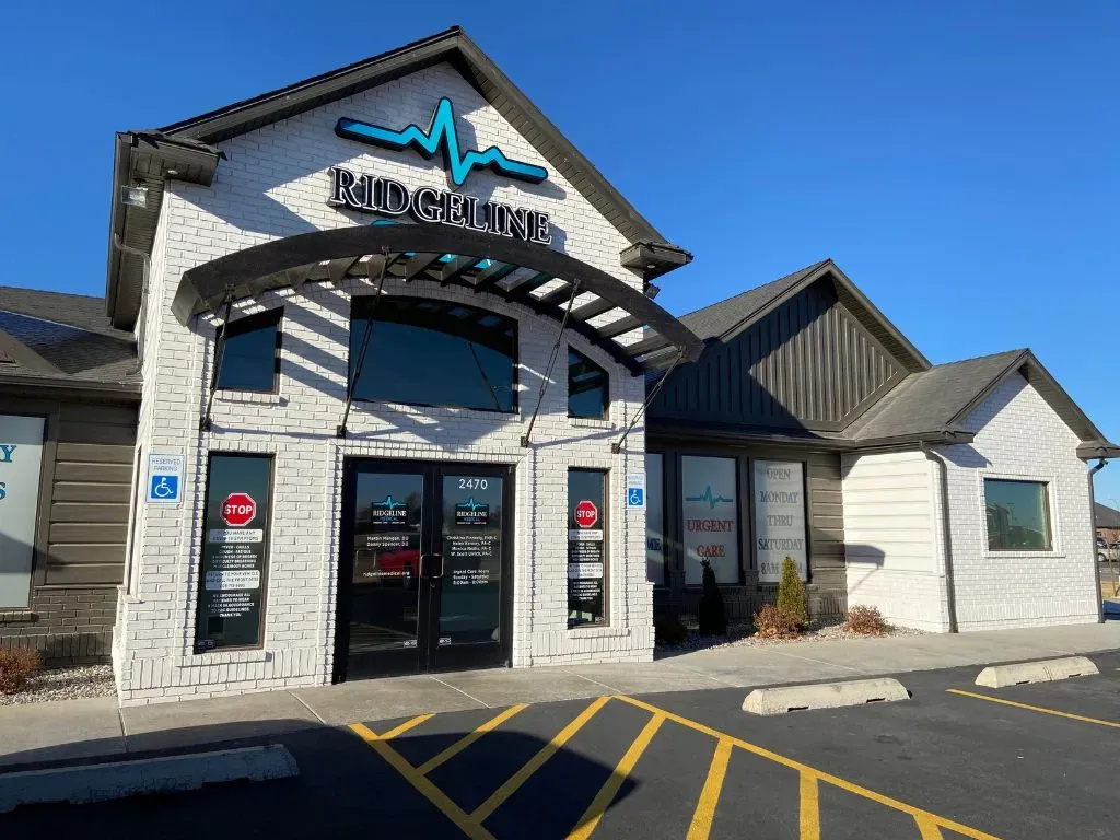 Urgent care building with a modern design and blue accents.